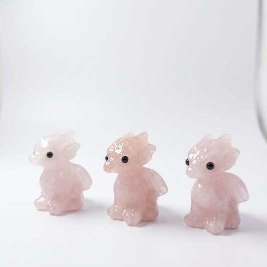 Natural Rose Quartz Dragon Carvings on pure white background