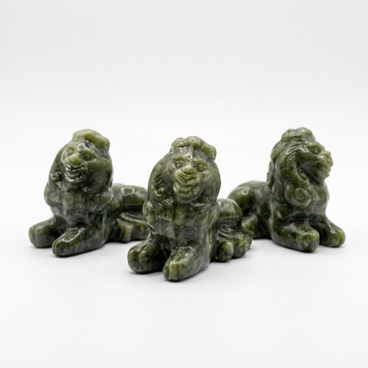 Natural Xiuyan Jade Lion Carving on pure white background